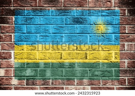 Rwanda flag on old brick wall background