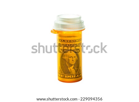 Rx bottle with a dollar bill inside isolated on a white background.Concept for Flexible Spending Account or medical expense FSA or health savings account (HSA) or a health reimbursement account (HRA).
