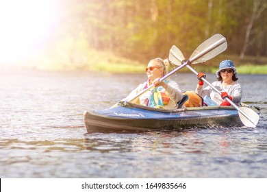 Ryazan, Russia - 05.09.2019: Couple Of Older Woman Enjoy Kayaking On The Summer River