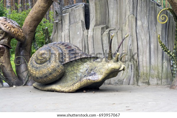 RYAZAN, RUSSIA - 19 JULY, 2017: Children\'s\
playground with toadstools with eyes, snails, flowers and other\
animals. Ryazan Park \