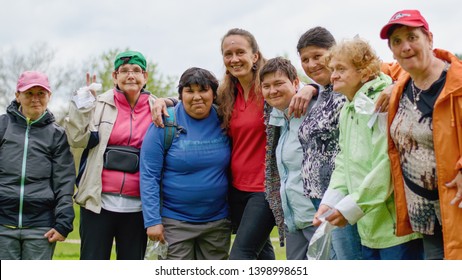 Rybna nad Zdobnici, Czech Republic, 11.5.2019 - Day Of Smiles, beneficent charity happening for handicapped children.  Group of happy smiling handicaped women with their nursemaid