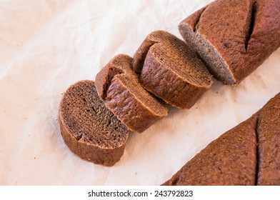 Rye bread on the table cut into pieces