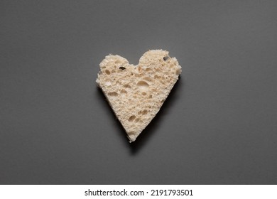 Rye bread in the shape of heart cut into slices on a gray background - Powered by Shutterstock