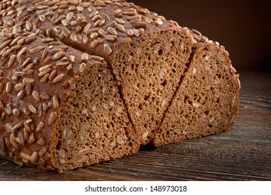 Rye Bread With Sunflower Seeds On The Wooden Table