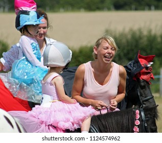 Rye, East Sussex/UK 08-16-14 A Family Enjoying The Fancy Dress For Horses Competition At Rye Show 2014