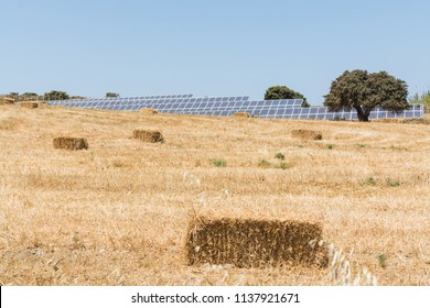 Rye Field With Bales Of Hay And Solar Energy Batteries In Milos Island, Greece