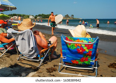 Rye, NH, USA June 16 A Senior Couple Relaxes On The Sands Of The New England Coast Near Rye, New Hampshire