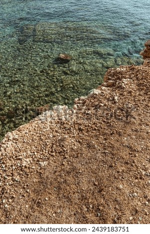 rystal-clear waters along the rocky Mediterranean coastline.