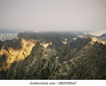 Rysy Tatry Peak Poland Obscured By Clouds At Sunset.