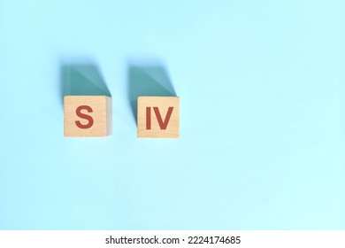 S IV basic sentence pattern English grammar concept. Wooden blocks flat lay on blue background.