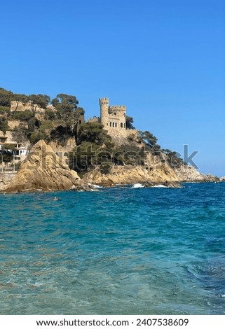 Sa Caleta beach and historic Castle d’en Plaja, Lloret de Mar, Spain. Imagine de stoc © 