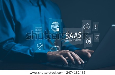 SaaS Concept, Software as a Service, A man types on laptop with digital icons representing various aspects of Software as a Service (SaaS), emphasizing modern technology platforms and cloud computing.