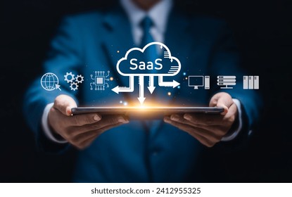 SaaS (software as a service) concept, Businessman show virtual screen of SaaS icons for software services on cloud system. Internet and networking technology.