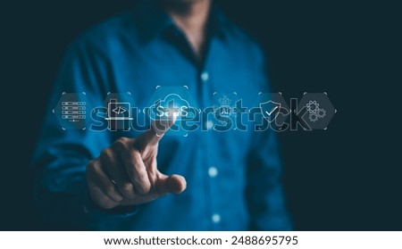 SaaS or software as a service concept. Businessman interacting with digital icons for SaaS, AI, programming, security, server management, modern technology, and innovation. Cloud system, network tech,