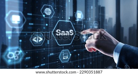 SaaS software as a service concept with hand pressing a button