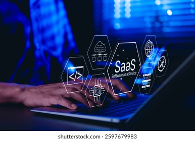 SaaS Software as a Service Concept. Man using laptop with futuristic interface SaaS (Software as a Service) icons, cloud computing, solutions, software development elements, modern technology platform
