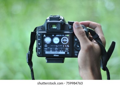 Sabah, Malaysia - November 20, 2017 : Close Up Of Hand Holding Camera To Taking Photo Of Green Nature