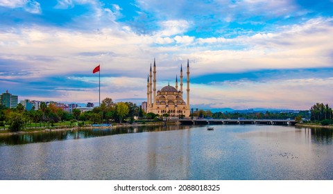 Sabanci Central Mosque (Turkish: Sabanci Merkez Cami) and Seyhan River in Adana, Turkey. Turkey's largest mosque with blue sky.