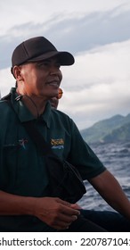 Sabang, Indonesia - July 30, 2022: Sabang Man Tour Guide Portrait Photo Wearing A Hat On A Boat, Weh Island 