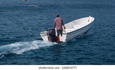 Sabang, Indonesia - July 30, 2022: A Tour Guide Rides His Boat On Rubiah Beach, Sabang