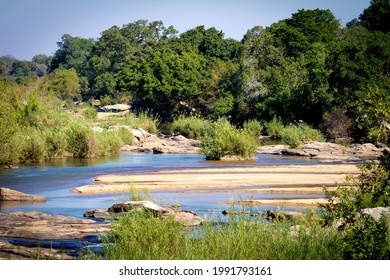 Sabie River With Sandbank At Midday  