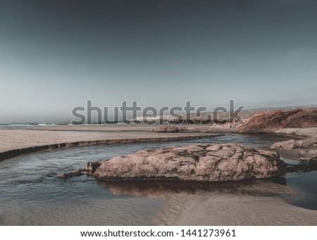 Similar – Image, Stock Photo Beach with rocks and puddle in a sunset, ribadeo, lugo, galician, spain