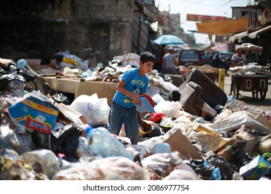 Sabra And Chatila, Beirut Lebanon -  ‎‎October ‎14  ‎2017:  ‎A Refugee Child Searches For A Toy In The Garbage