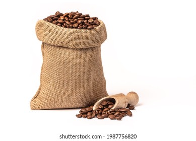 Sack with brown roasted coffee beans. Burlap sack. Scoop with grains. - Shutterstock ID 1987756820