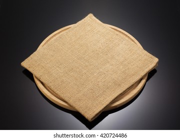 Sack Burlap Napkin At Cutting Board Black Background