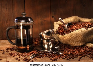 Sack Of Coffee Beans With French Press And Cups