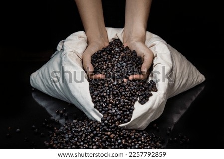 Similar – Hand of young boy full of black olives