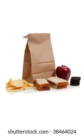 A Sack Lunch With Peanut Butter Sandwich And A Apple