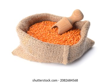 Sack with red lentils on white background