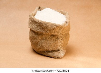 Sack with sugar on extra-strong paper background