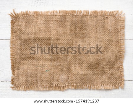Sacking cloth on a wooden background