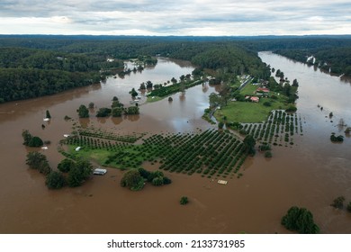 Sackville, NSW, Australia - March 9, 2022. Aerial view of the Hawkesbury River in flood over roads and farmland in outer rural Sydney.