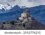 The Sacra di San Michele, a 10th-century abbey in Piedmont, Italy, crowns Mount Pirchiriano. Rich in history, it inspired The Name of the Rose and offers stunning views of the Alps.