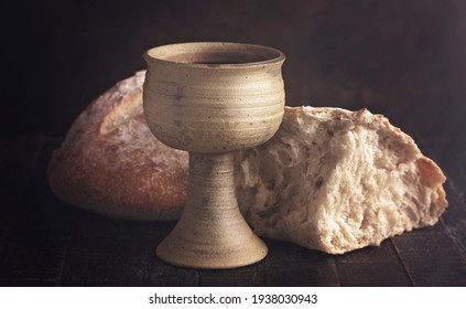The Sacrament of Holy Communion  on a Dark Wooden Table - Shutterstock ID 1938030943