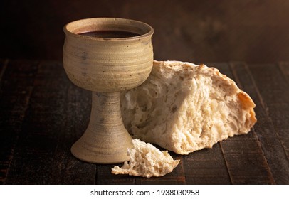The Sacrament of Holy Communion  on a Dark Wooden Table - Shutterstock ID 1938030958