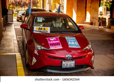 Sacramento, CA—Aug 28, 2019; Gig Economy Driver’s Car With Uber And Lyft Tags With Pro Union Signs To Protest In Support Of California Assembly Bill AB5 That Would Give Unionization Rights