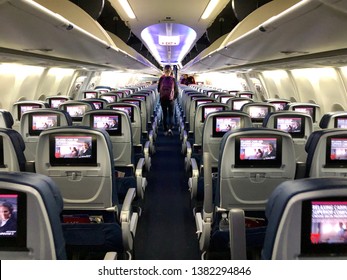 SACRAMENTO, CA - APR 25, 2019: Delta Airplane Airplane Interior With Person Deplaning. 