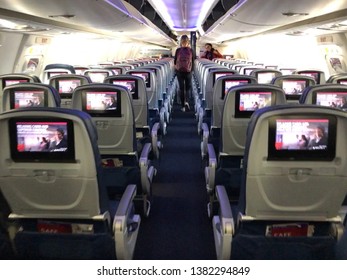 SACRAMENTO, CA - APR 25, 2019: Delta Airplane Airplane Interior With Person Deplaning. 