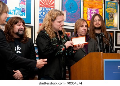 SACRAMENTO, CA - DEC 7: Brian Wheat and Frank Hannon of Tesla receiving the key to the City of Sacramento at the Rock and Roll Museum in Sacramento, California on December 7, 2011