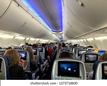 SACRAMENTO, CA, USA - APR 18, 2019: Delta airlines aircraft interior full of passengers