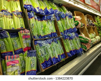 Sacramento, CA, USA. April 29, 2019 — Produce Food Items Such As Celery, Romaine Lettuce, Carrots, And Iceberg Lettuce Are Being Displayed In Produce Aisle In A Grocery Store. 