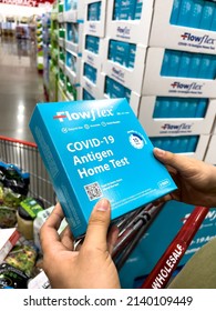 Sacramento, CA, USA March 25th, 2022 Shoppers Hands Holding A Box Containing Flowflex Brand Covid-19 Antigen Home Test At A Local Discount Warehouse Store