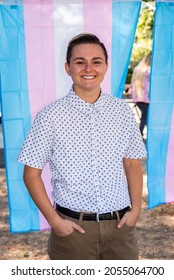 SACRAMENTO, CA, U.S.A. - OCTOBER 9, 2021: Lauren Pulido, The New Co-Executive Director Of The Gender Health Center, Stands In Front Of A Transgender Flag At National Trans Visibility March Day.