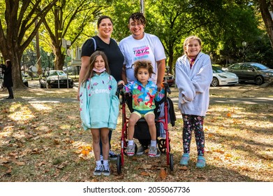 SACRAMENTO, CA, U.S.A.- OCTOBER 9, 2021: Judah Joslyn, Executive Director Of The Trans  Queer Youth Collective, Poses With His Family As Part Of National Trans Visibility March Day.