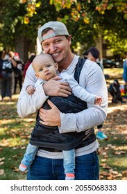 SACRAMENTO, CA, U.S.A. - OCTOBER 9, 2021: Alex Breen Poses With Miabella, His Child, As Part Of National Trans Visibility March Day.