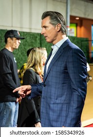 SACRAMENTO, CA/U.S.A. - DECEMBER 10, 2019: Candid Photo Of California Governor Gavin Newsom Pointing In A Discussion As Part Of The Red Carpet Event At The Hall Of Fame Inductees Event.